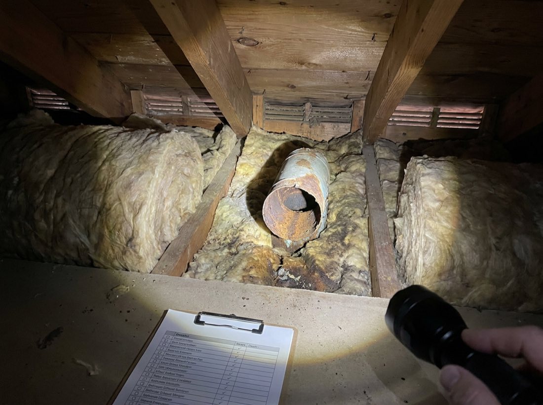Blocked soffit vents and a bathroom exhaust venting into the attic